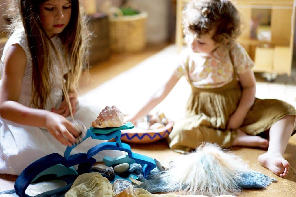 Two children co-operating and playing together