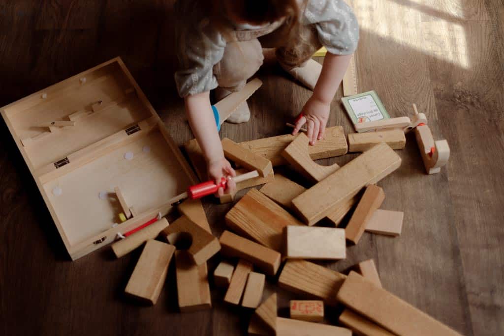 A child enjoying open-ended play with blocks