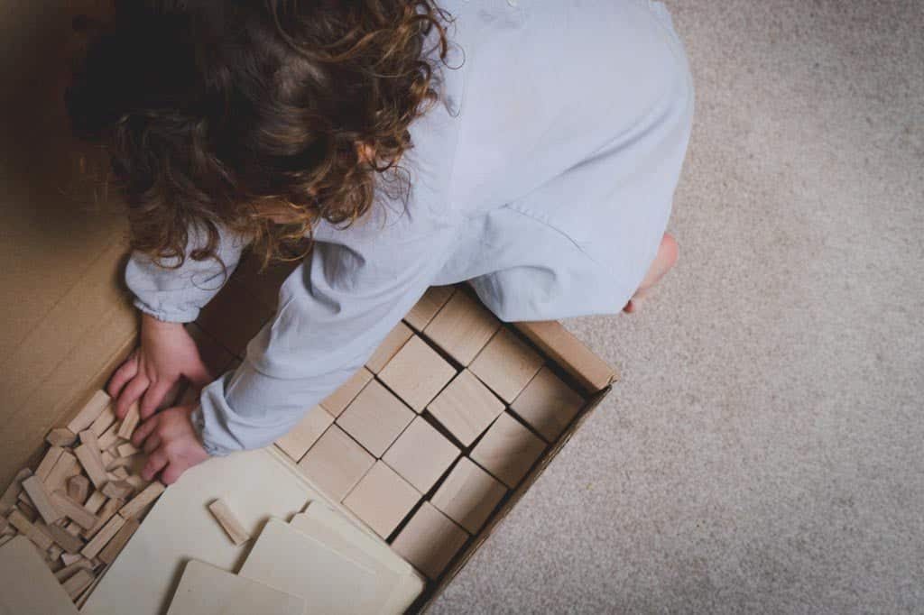 A child choosing blocks and  playing independently