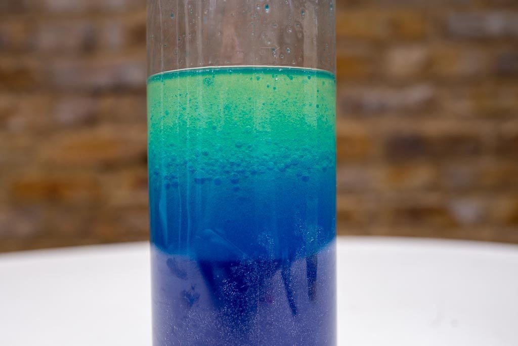 Oil and water in a bottle, shaken to look like a lava lamp