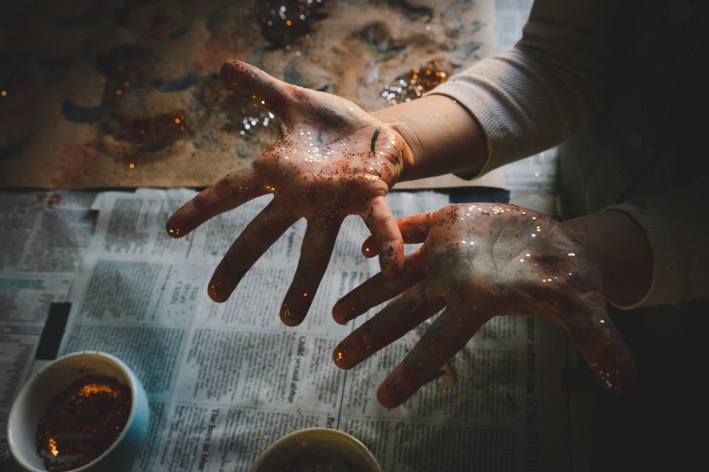 Messy hands, covered in glitter