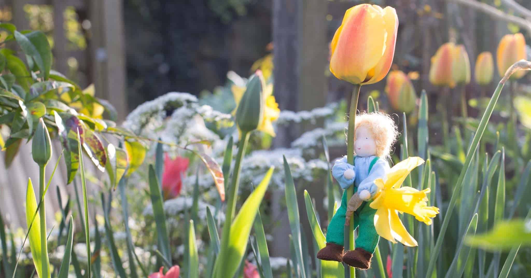 Grimm's doll among the flowers