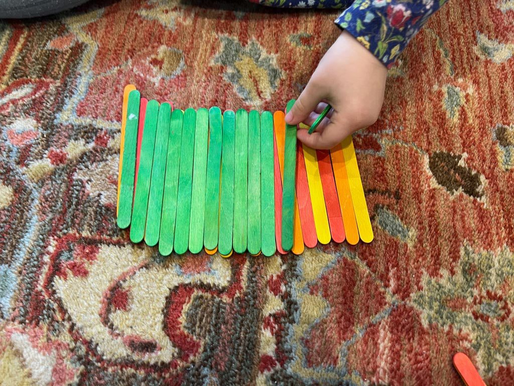 Lolly sticks representing a fire on a barbecue