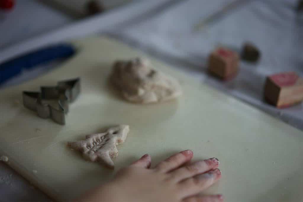 Cut out salt dough shapes with biscuit cutters