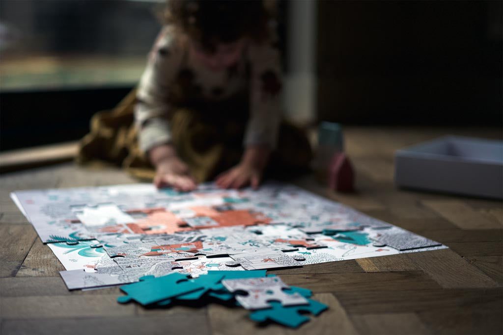 A child completing a puzzle