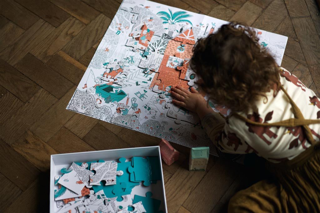 Picture of preschooler completing a 100-piece puzzle