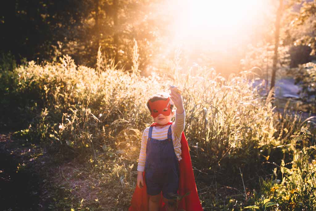 Boy pretending to be a superhero