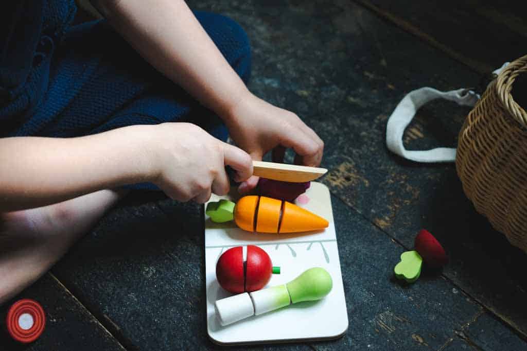 Child chopping pretend food