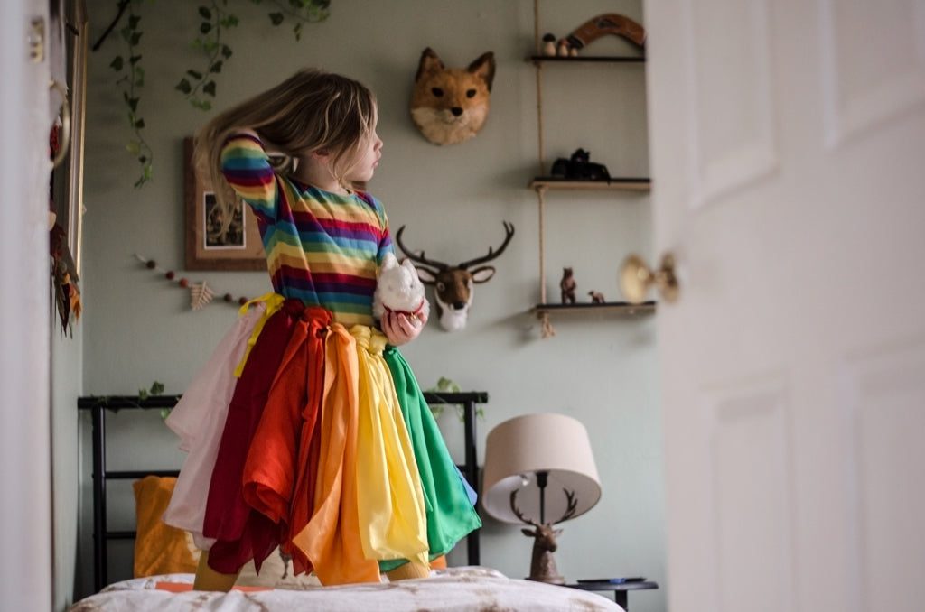 Silks tucked into waist to make a colourful skirt