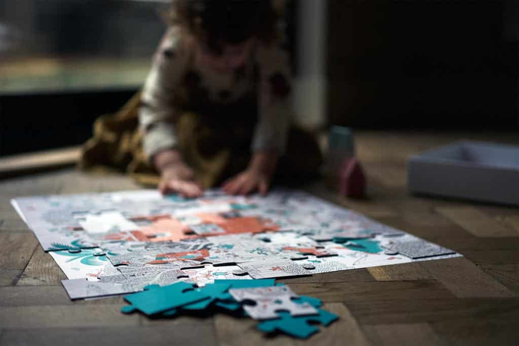 A child learning spatial reasoning with a puzzle