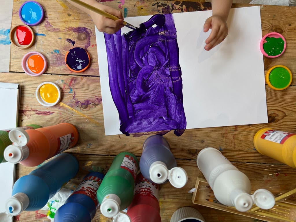 Process art - a child experimenting with paint and forms