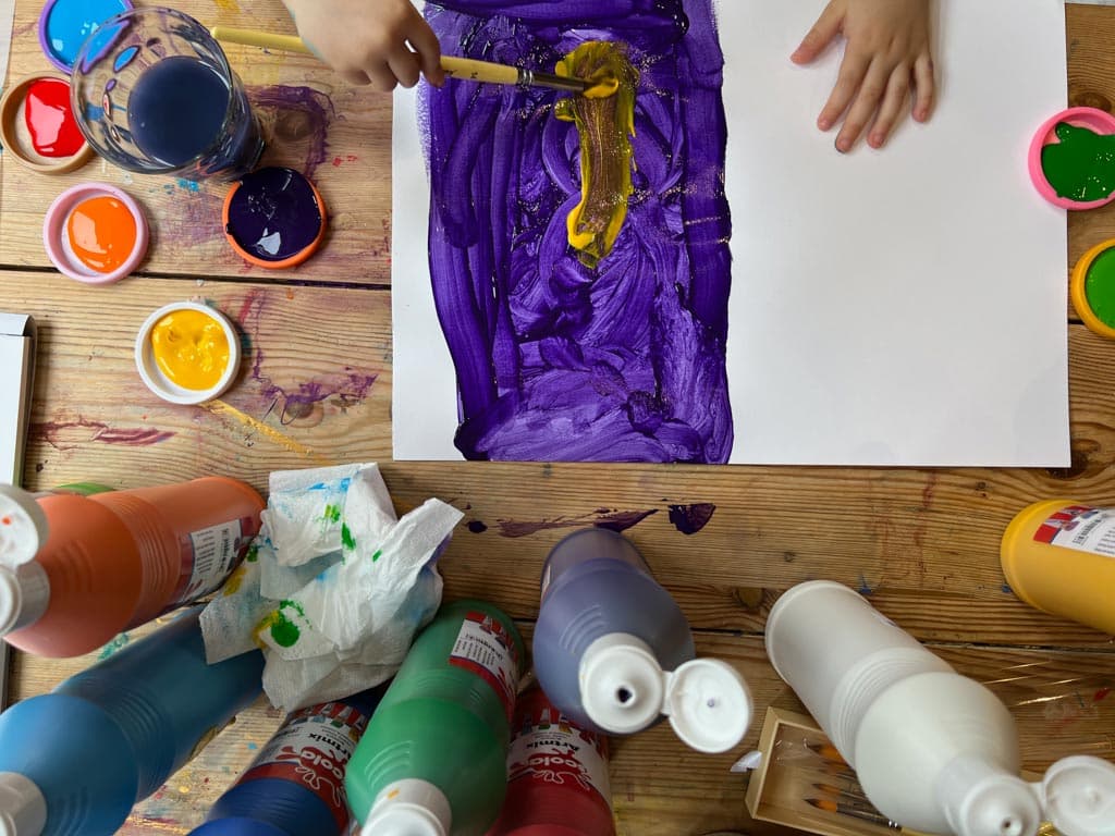 Process art - a child experimenting with paint and forms