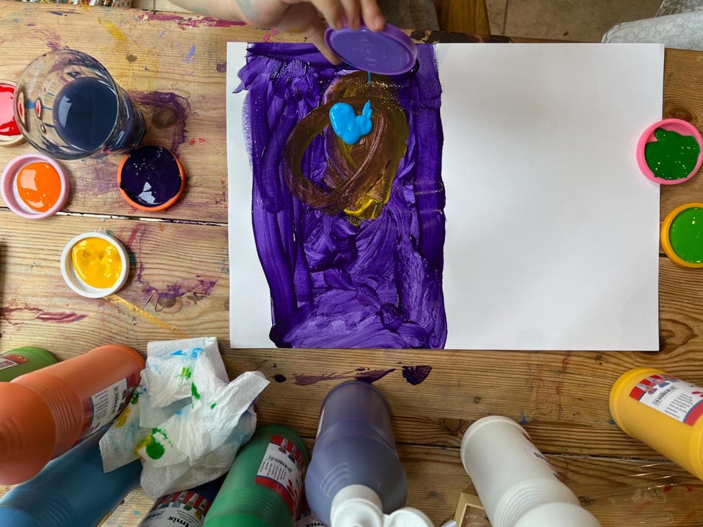 Process art - a child experimenting with paint and forms